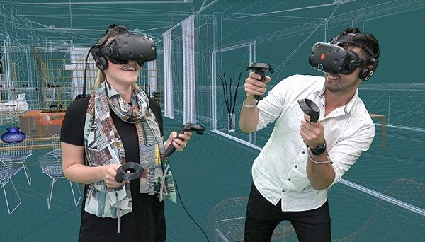 Ljudi nose naočare za VR da bi videli virtuelnu strukturu u 3D žičani model u okruženju u VR centru za izvrsnost kompanije Autodesk u Minhenu.